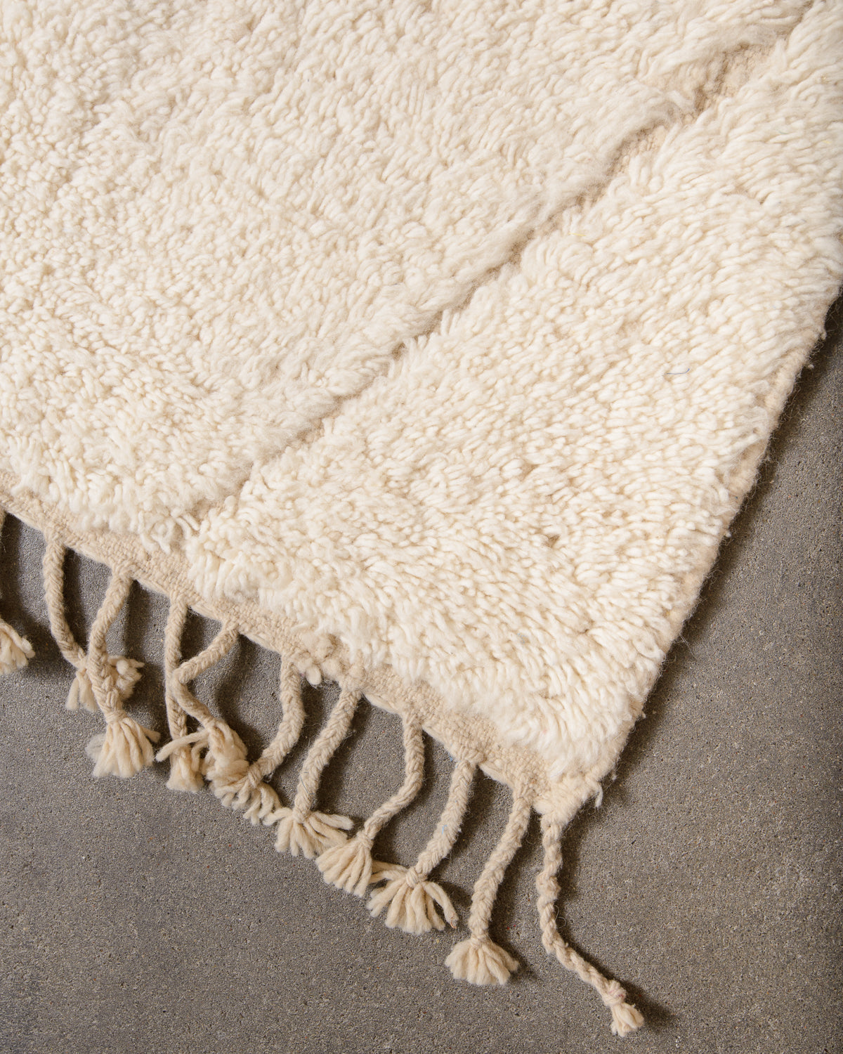 Modern, designer, handcrafted Berber rug from Morocco. Beniourain carpet with minimalist design, natural wool pile and a fluffy texture.